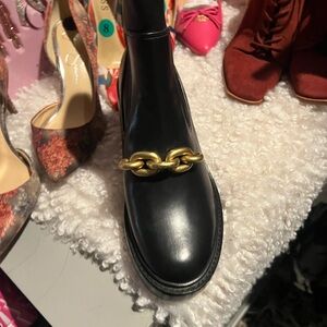 Black coach boots size 8.5 
Never worn